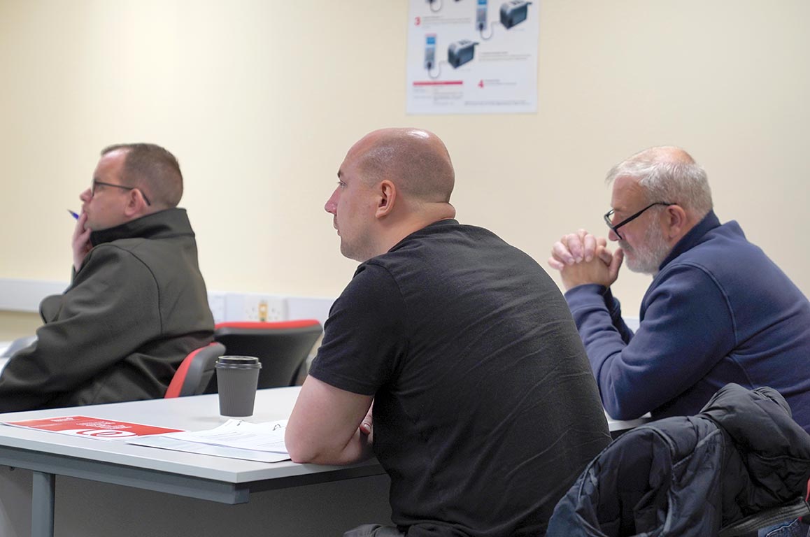 Learners paying attention to the tutor on a safe isolation course