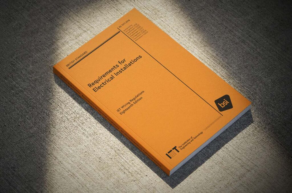 IET Wiring Regulations Orange Book on the floor