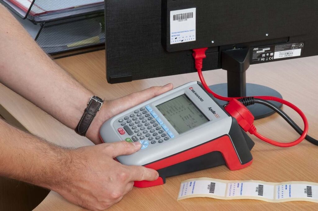 Apollo 600 PAT Tester running through a test on a monitor